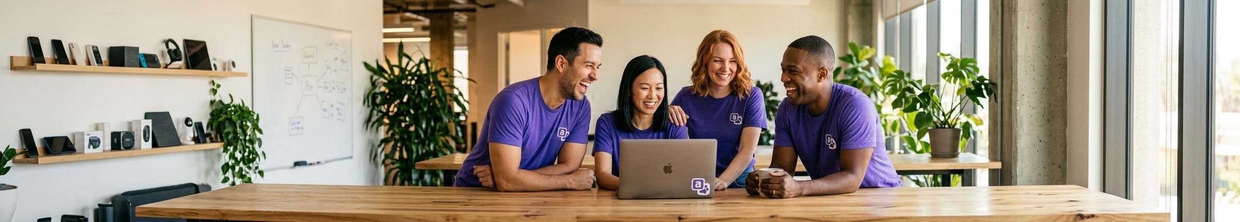 Cat Translator team gathered around a laptop